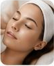 Woman relaxing during a facial